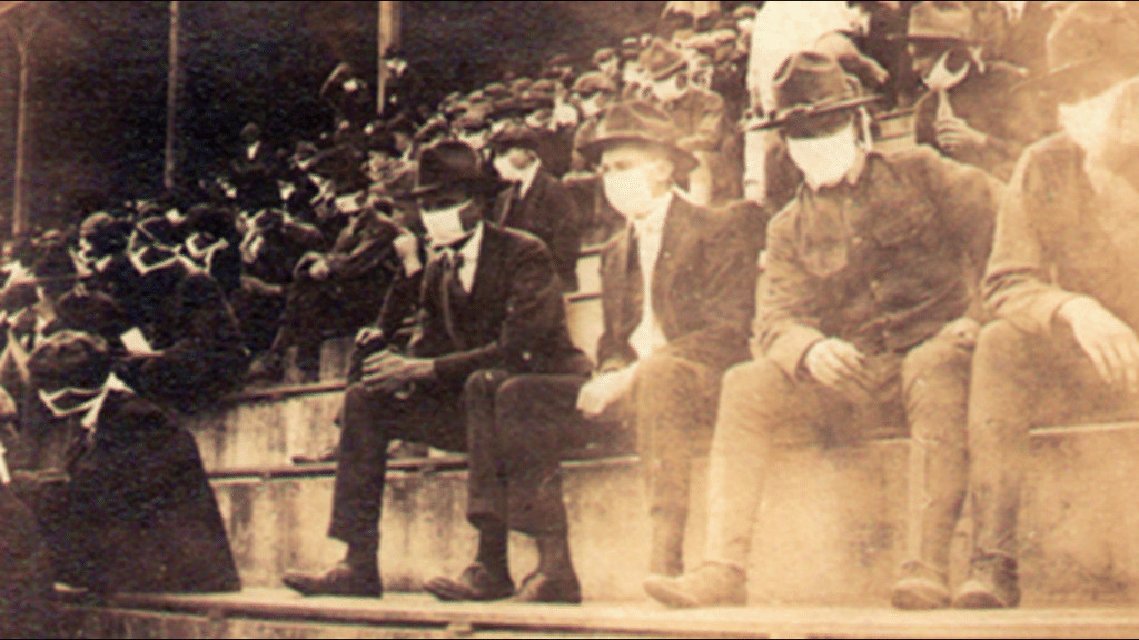 pensarcontemporaneo.com - Imagem vintage mostra f&atilde;s de futebol usando m&aacute;scaras durante a pandemia de 1918